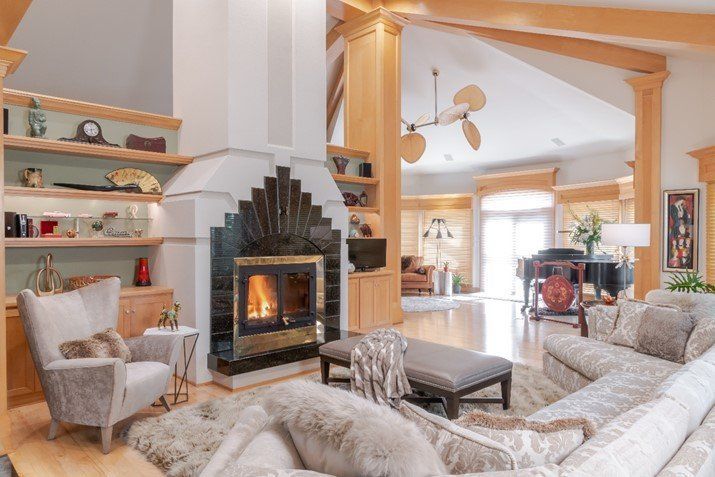 A living room filled with furniture and a fireplace.