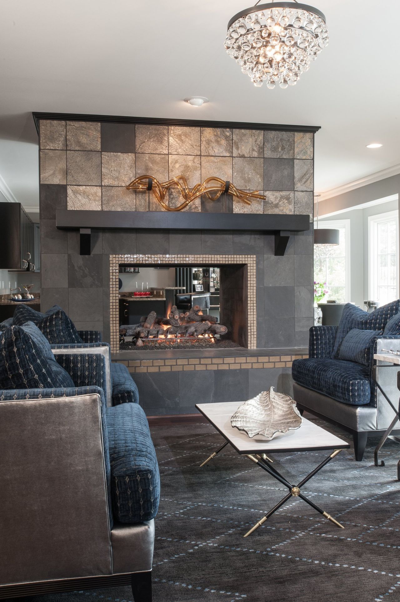 There is a fireplace in the middle of the living room.