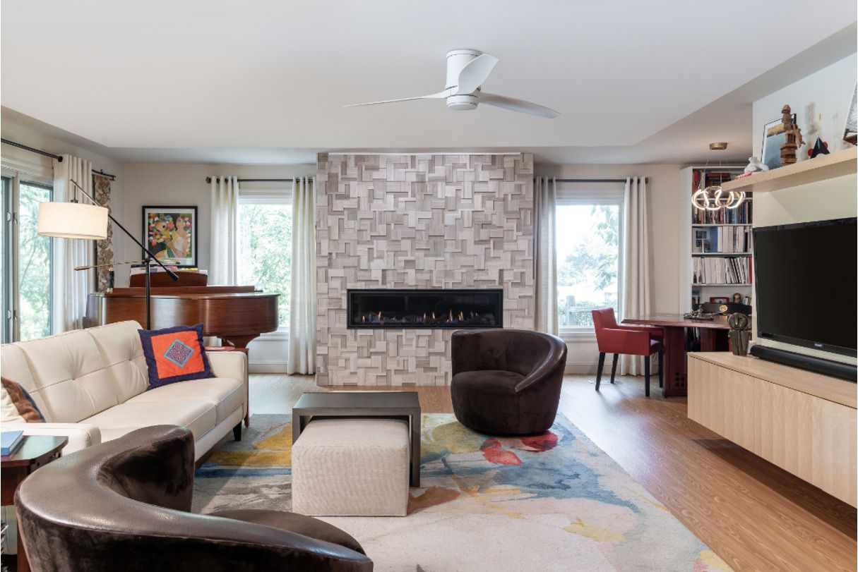 A living room filled with furniture and a fireplace.