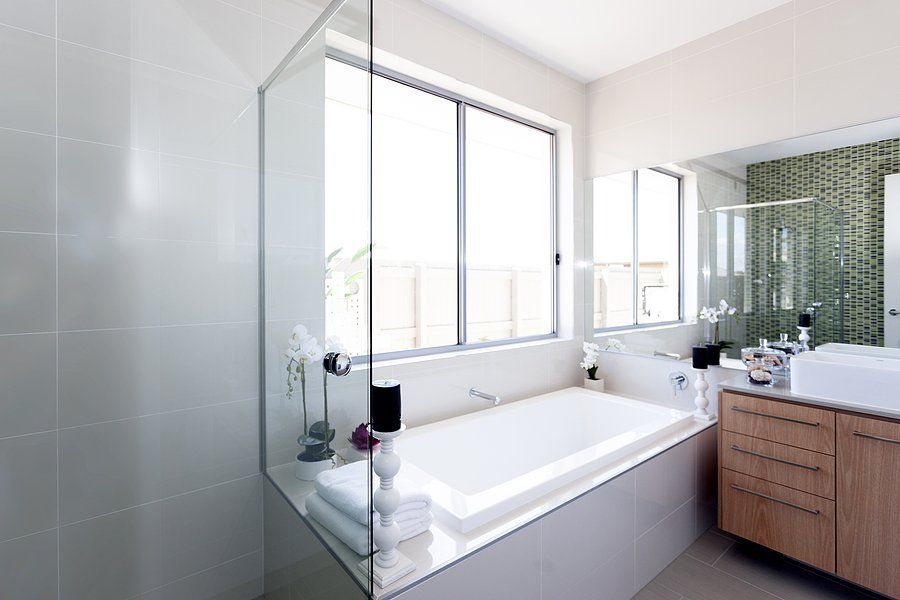 bathroom with tub and mirror