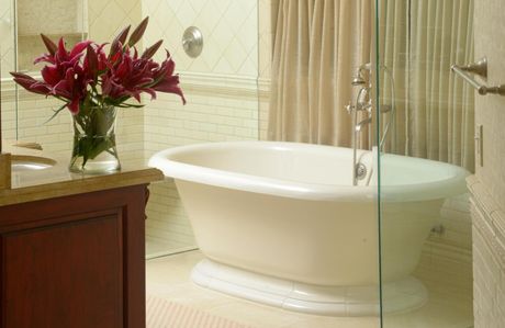bathroom with tub and flowers