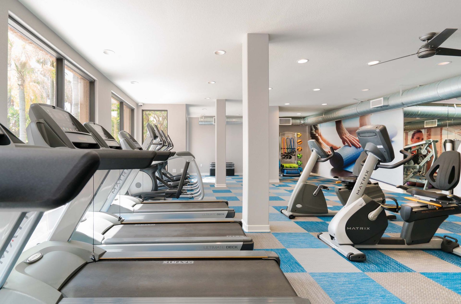 a gym filled with treadmills and exercise bikes .