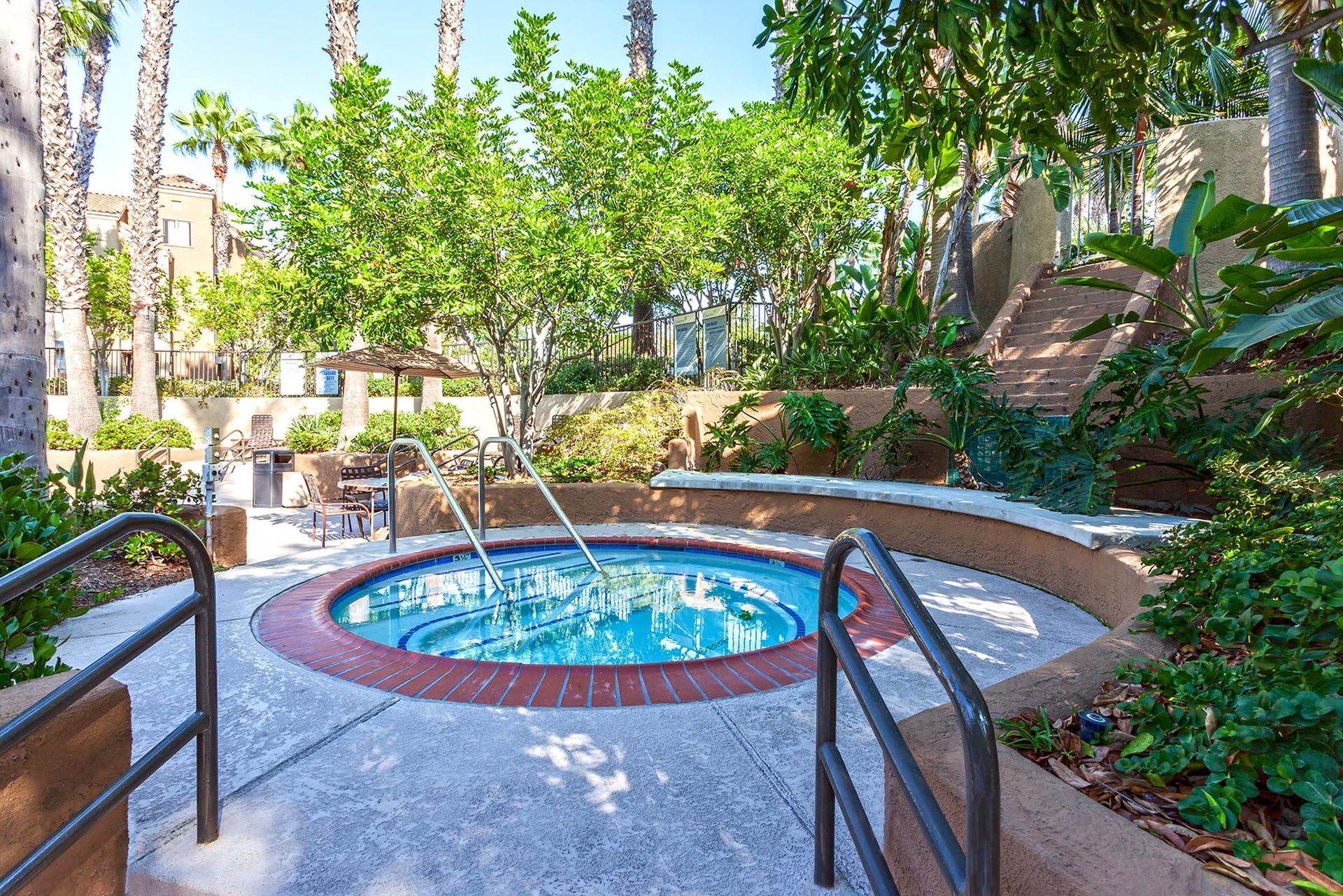 a hot tub with a fountain in the middle of it