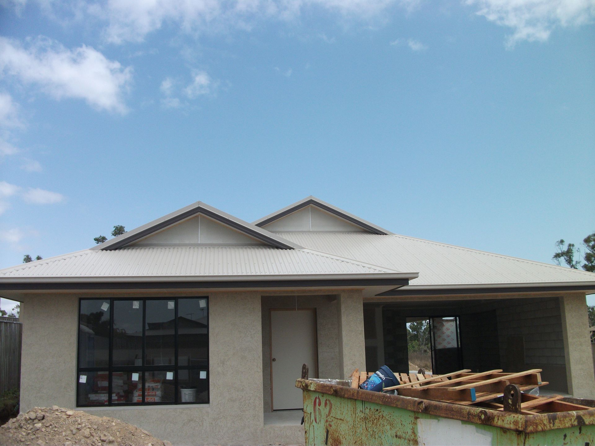 House Under Construction; Roof Partially Covered With Black Tiles and Scaffolding — Roof 4 U in Alice River, QLD