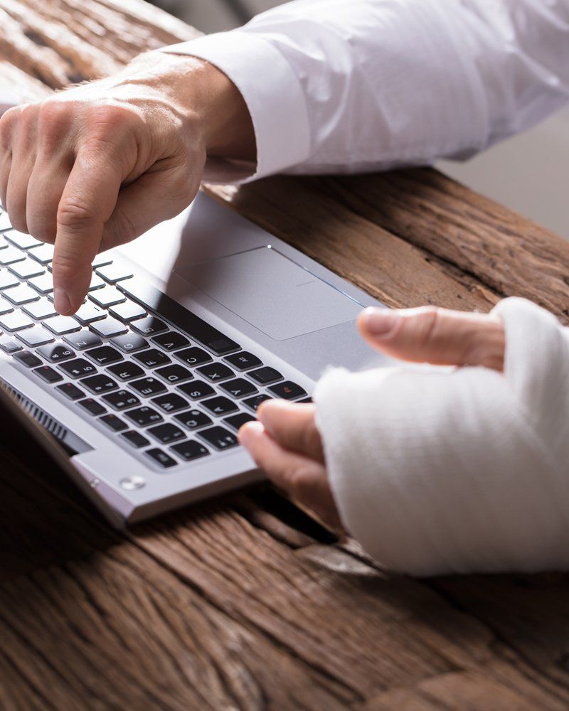 Injured Employee Using Laptop — Cumberland, MD — Buckel Levasseur Phillai & Beeman LLC