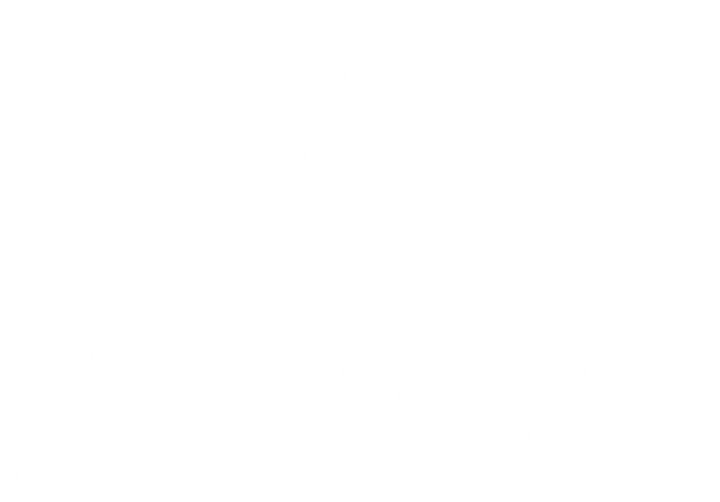 Fox Hollow white logo on a grey backgorund