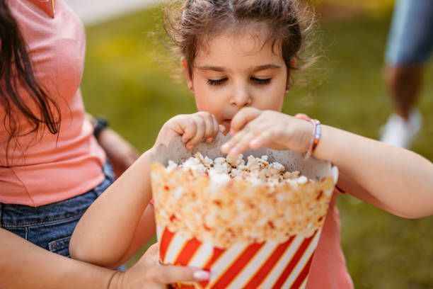 Girl Eating a Popcorn — Hoffman Estates, IL — Bash Box-Party In A Box