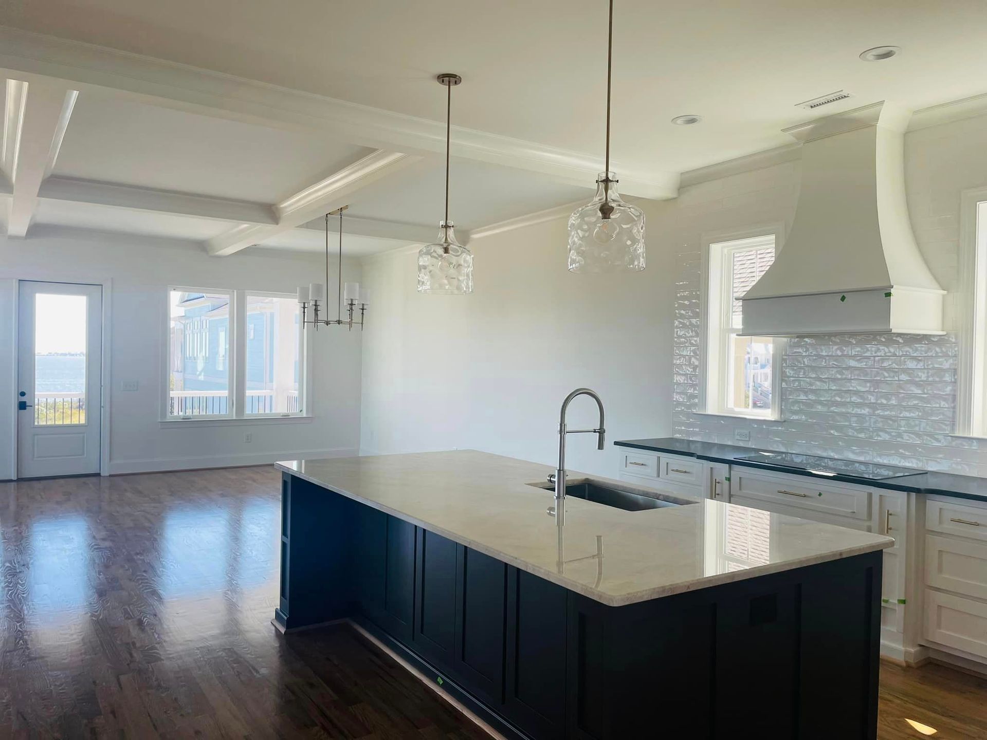 there is a large island in the middle of the kitchen .