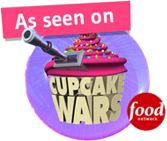 A cupcake with a cannon on top of it that says cupcake wars