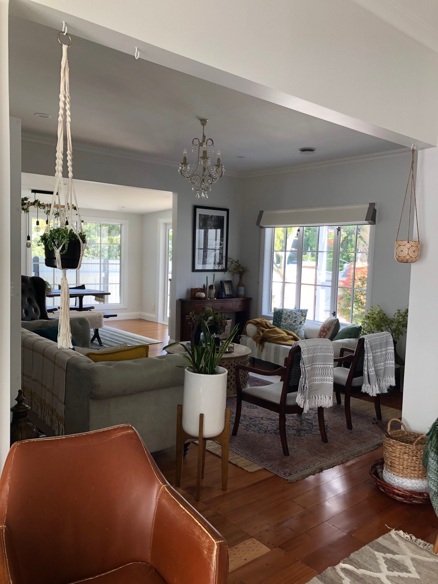 A living room filled with furniture and a chandelier.