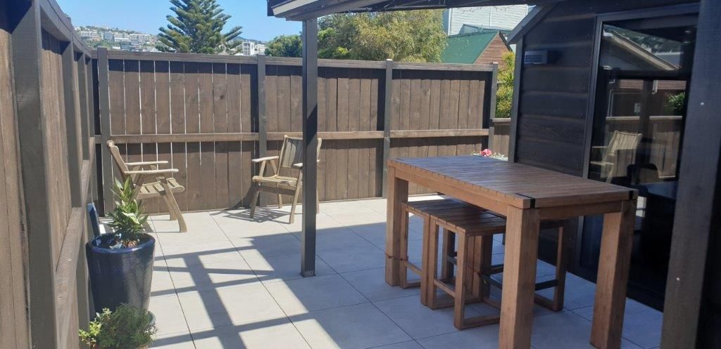 shaded patio with outdoor dining