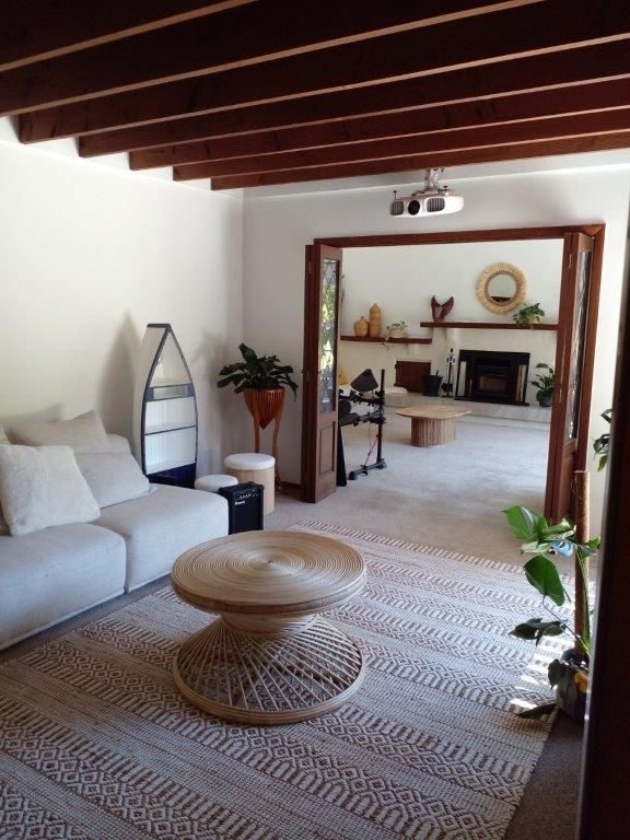 open plan living area with beams