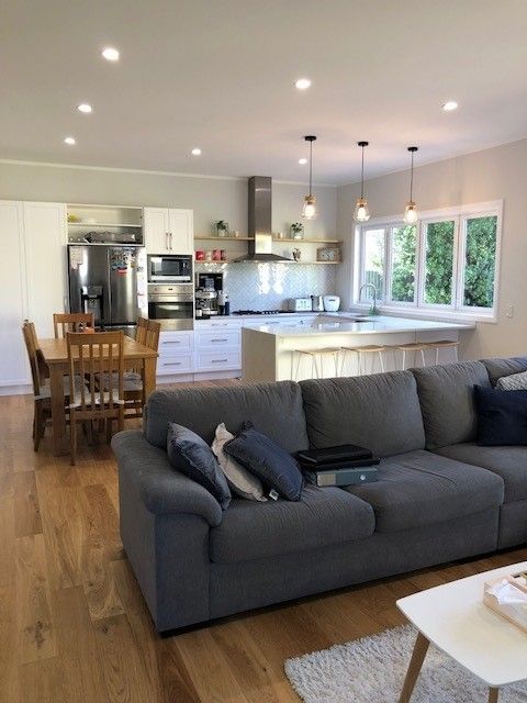 A living room with a couch and a table in it