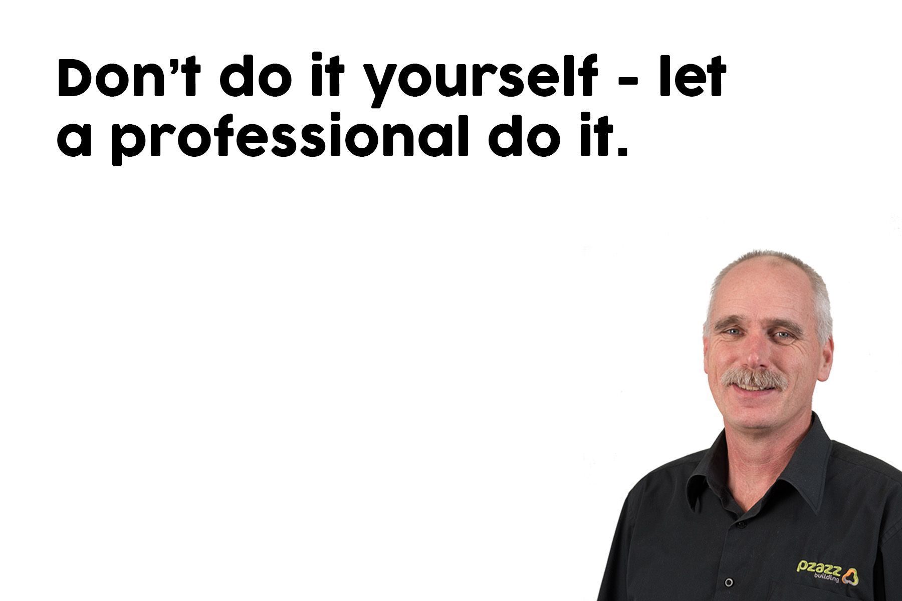 A man in a black shirt is standing in front of a white background.