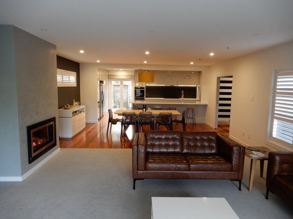 stylish sofa and fireplace in living area