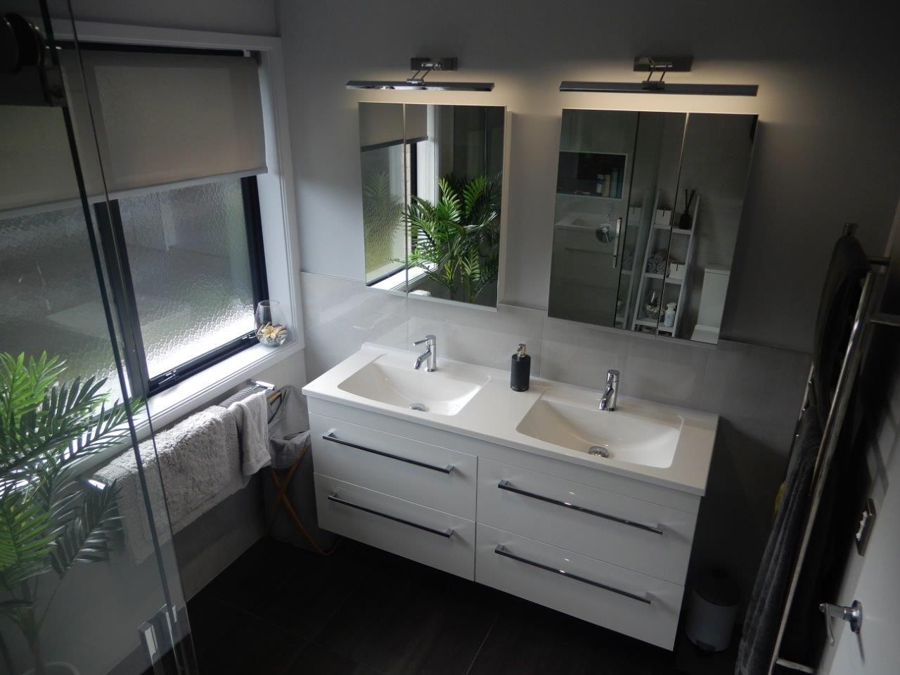 double vanity with two mirrors and vanity lights