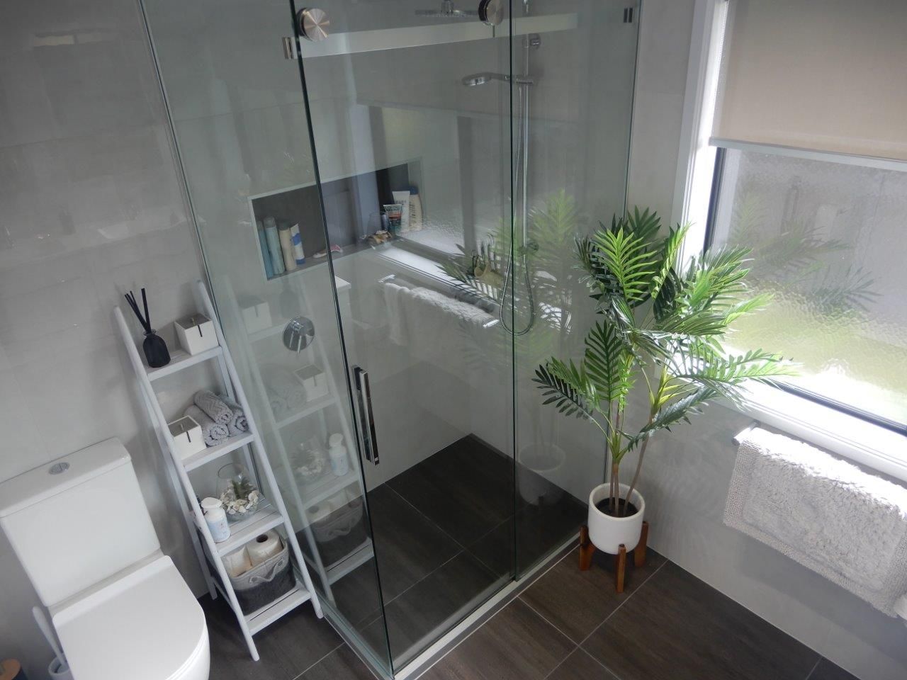 sleek bathroom with white and grey tile