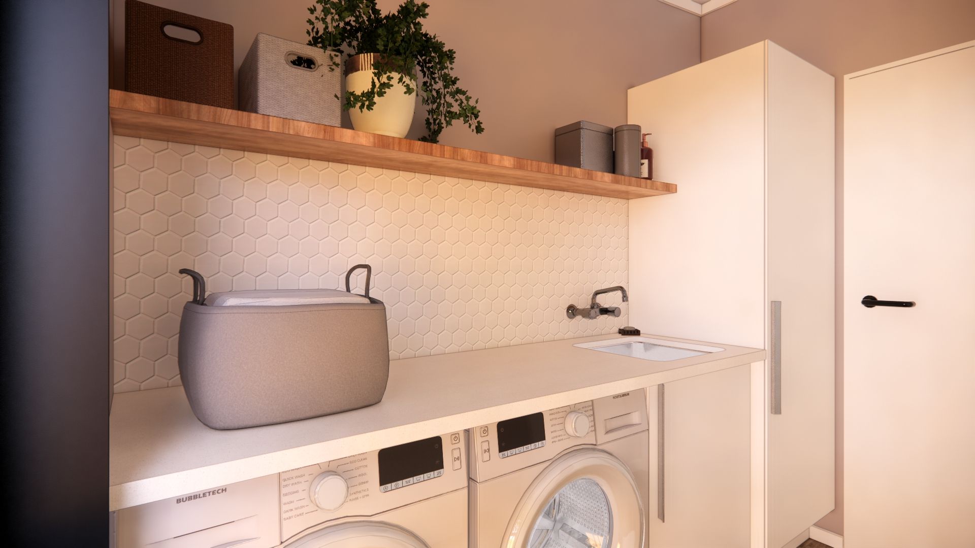 A laundry room with a washer and dryer and a sink.