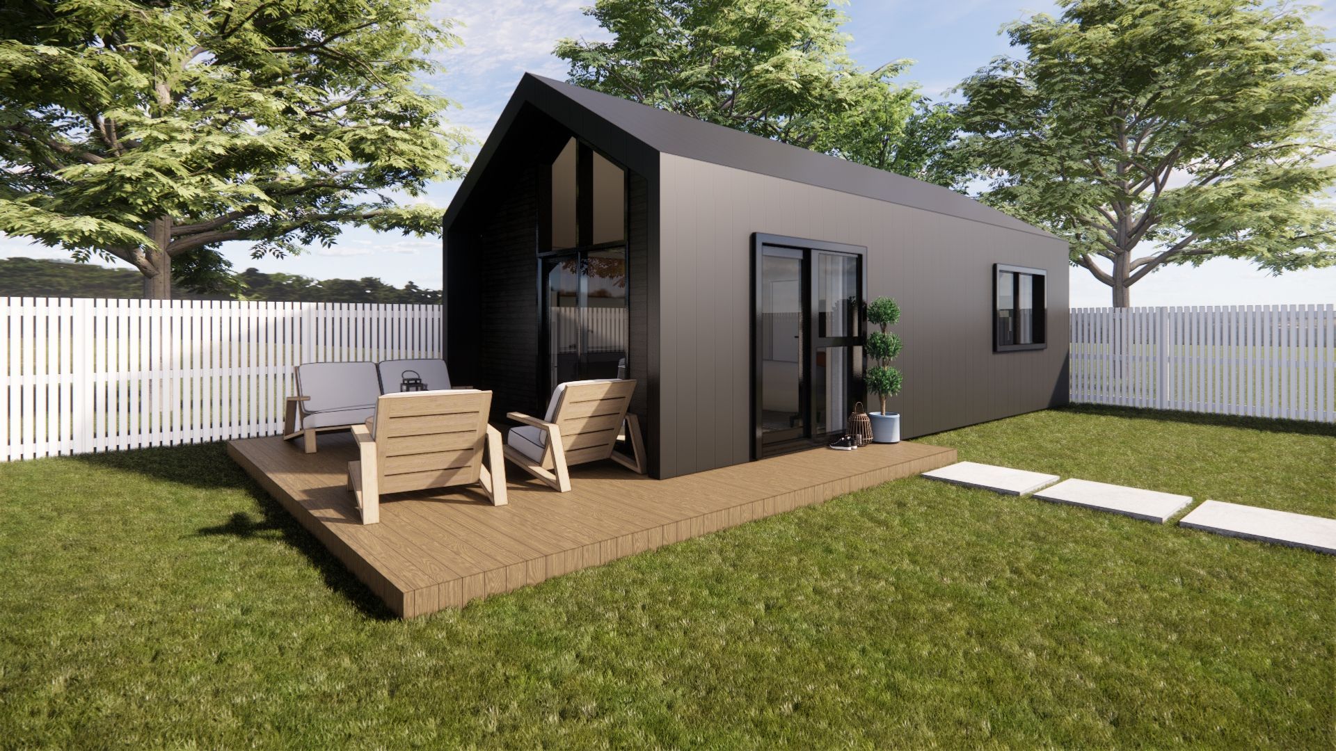 A small house with a deck and chairs in the backyard.