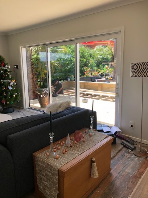 open plan area with large doors leading to outdoor living