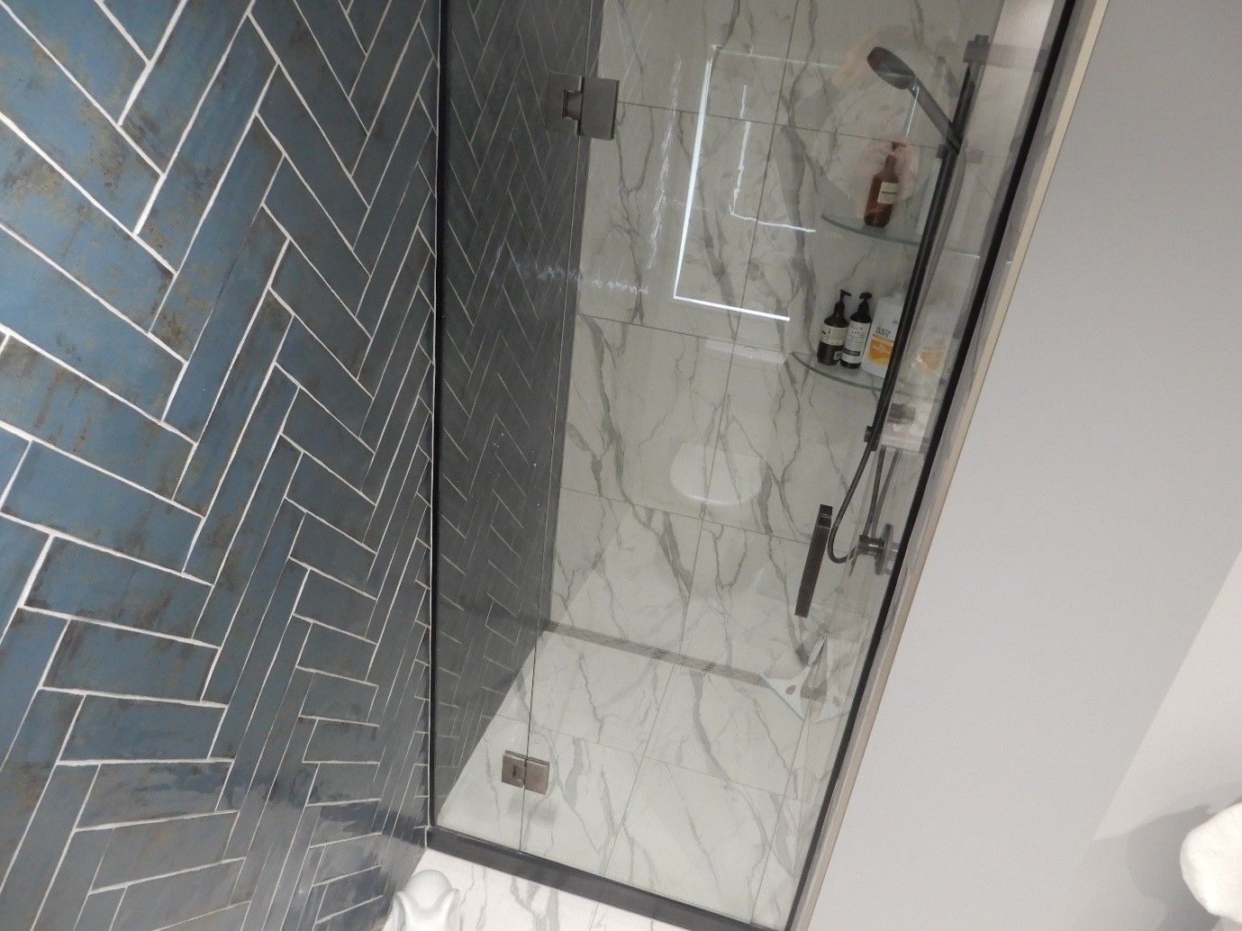 feature herringbone bathroom tile
