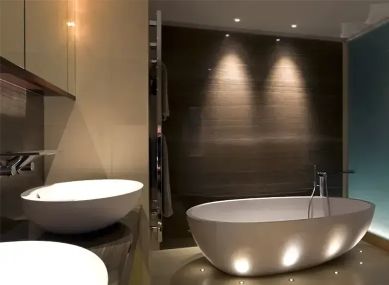 A bathroom with two sinks and a bathtub