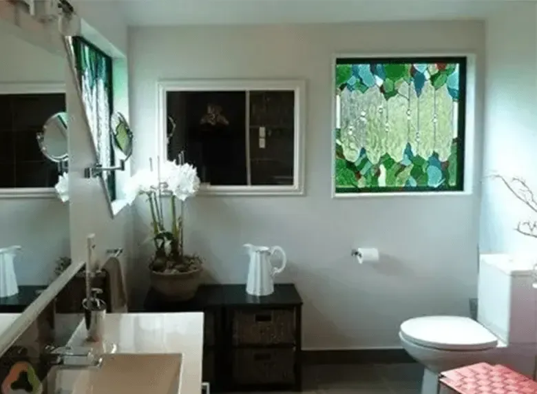 A bathroom with a sink toilet and mirror