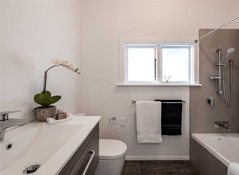 Renovated bathroom with modern, clean look and peaceful decor.