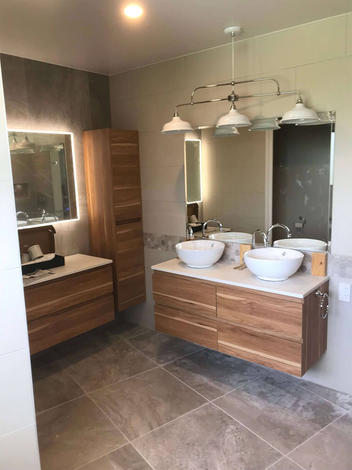 ensuite bathroom with double counter top basins