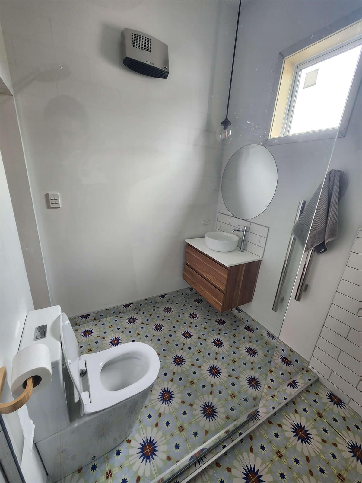 funky bathroom tile with walk in shower