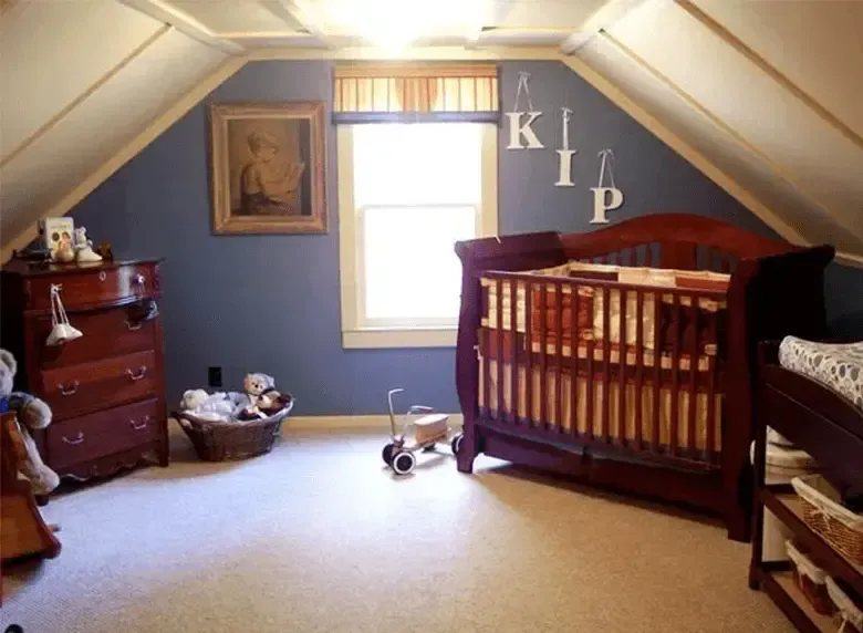 A baby room with a crib and a dresser