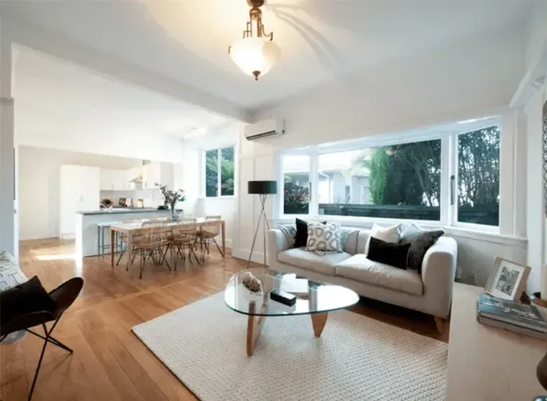 A living room with a couch and a coffee table