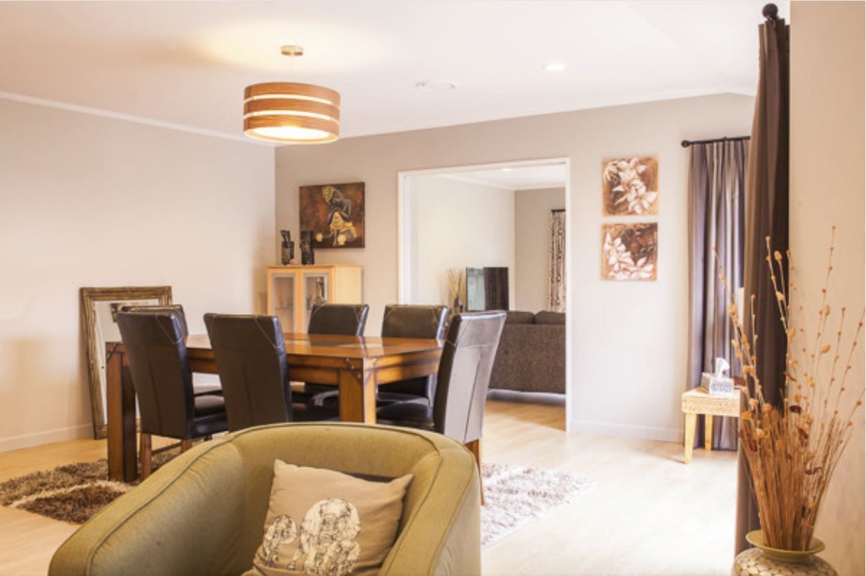 open plan living area with green accents