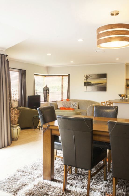 open plan living area with warm lighting