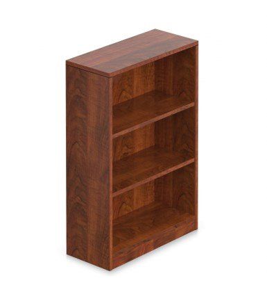 A wooden bookshelf with three shelves on a white background.