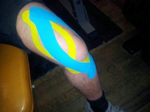 using sports tape on the knee