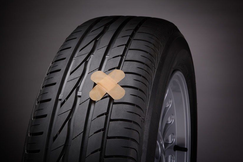 A Tyre With a Bandage on It That Looks Like a Cross — Wheel Alignment Centre In Braitling, NT