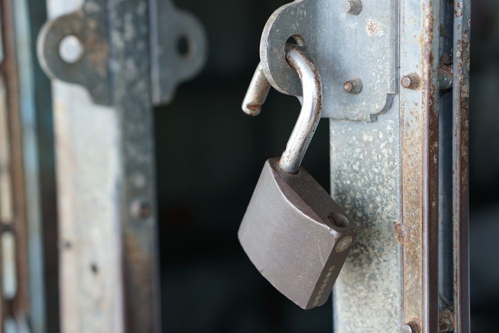 A Close Up Of A Padlock On A Metal Door — New Lock & Safe Services in Terang, VIC