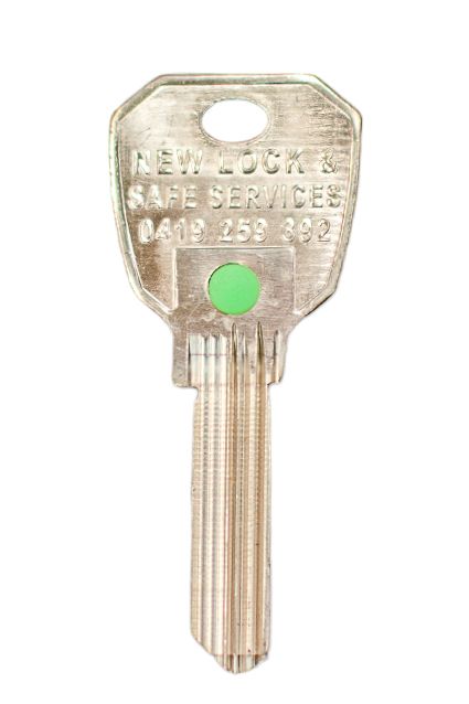 A Person Is Working on A Piece of Key in A Vise — New Lock & Safe Services in Hamilton, VIC