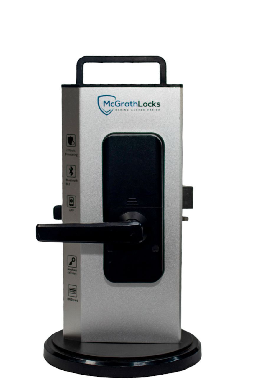 A Close up Of A Glass Door With A Key — New Lock & Safe Services in Port Campbell, VIC