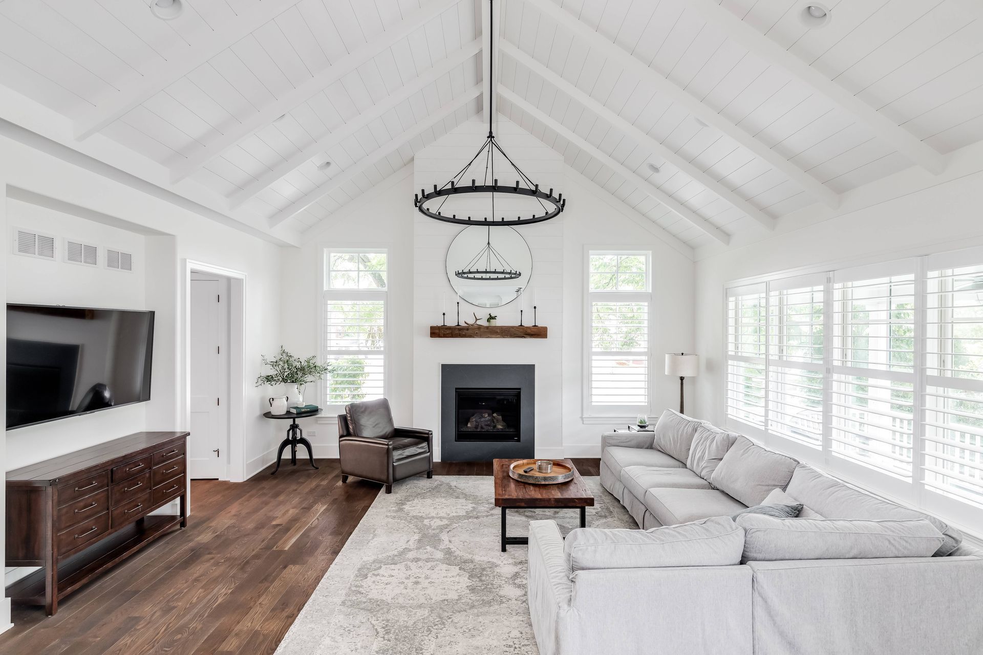 A living room with modern farmhouse style and white stylish shutters on the windows at The Blind Guy Lewiston near Clarkston & Pullman, WA