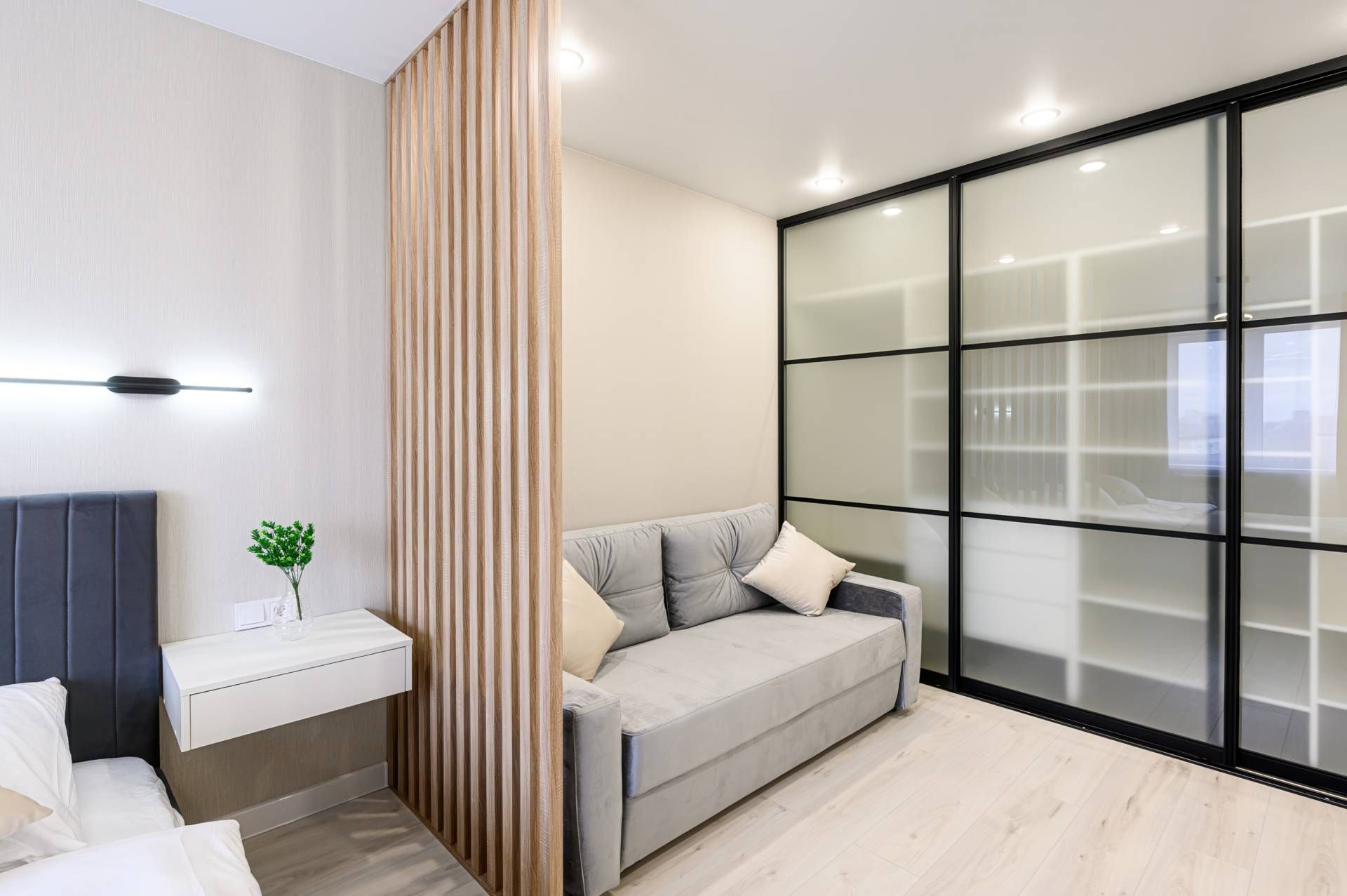 Organic-styled room divider, separating a bedroom and sitting area without closing off the entire sp