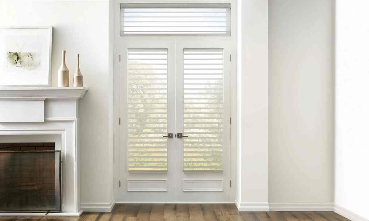 Stunning Hunter Douglas Silhouette® Sheer Shades on French doors in an airy living room at The Blind Guy Lewiston near Clarkston & Pullman, WA