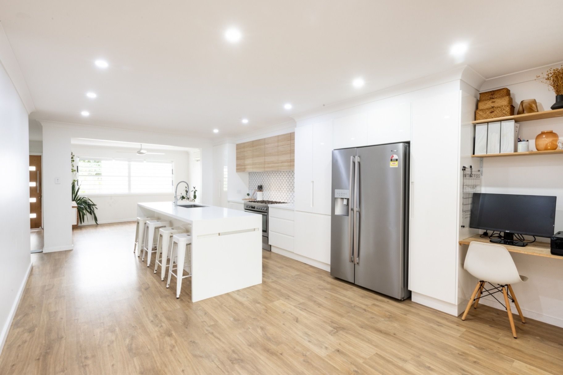 ontemporary kitchen featuring sleek cabinetry and stainless steel appliances