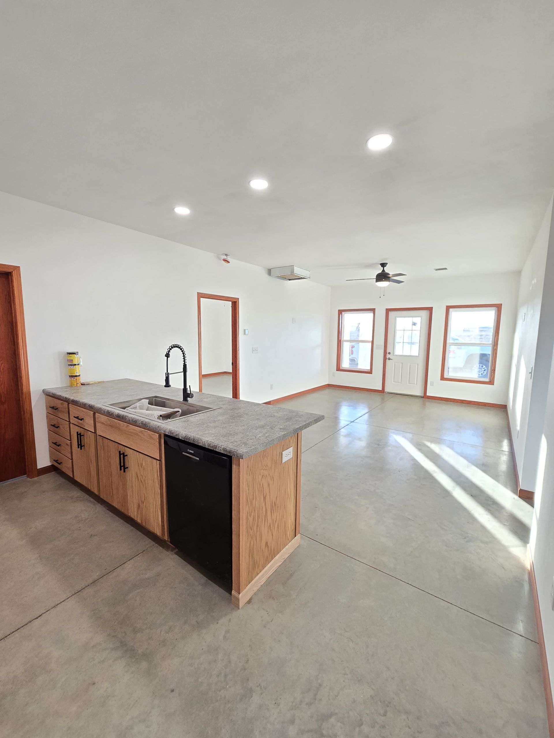 The inside of a moving truck filled with boxes and blankets.