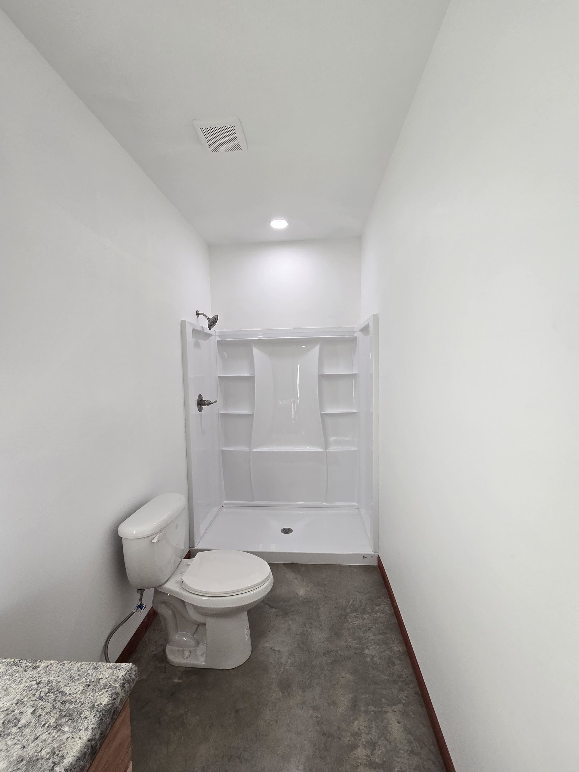 The inside of a moving truck filled with boxes and blankets.