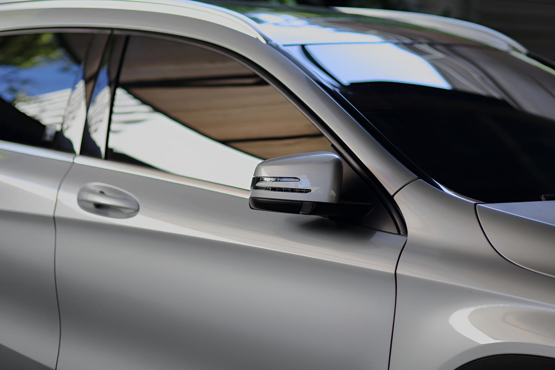 A Close Up Of A Silver Car With The Door Open — Carson's Car Care In Armidale, NSW