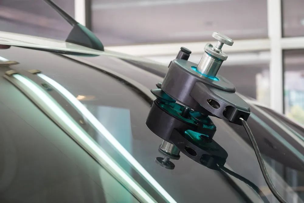 Windshield Repair Tool Attached to a Car Windshield — Southern Tablelands Windscreen Repairs in Taralga, NSW