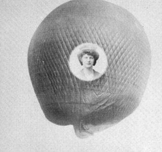 A black and white photo of a woman in a hat