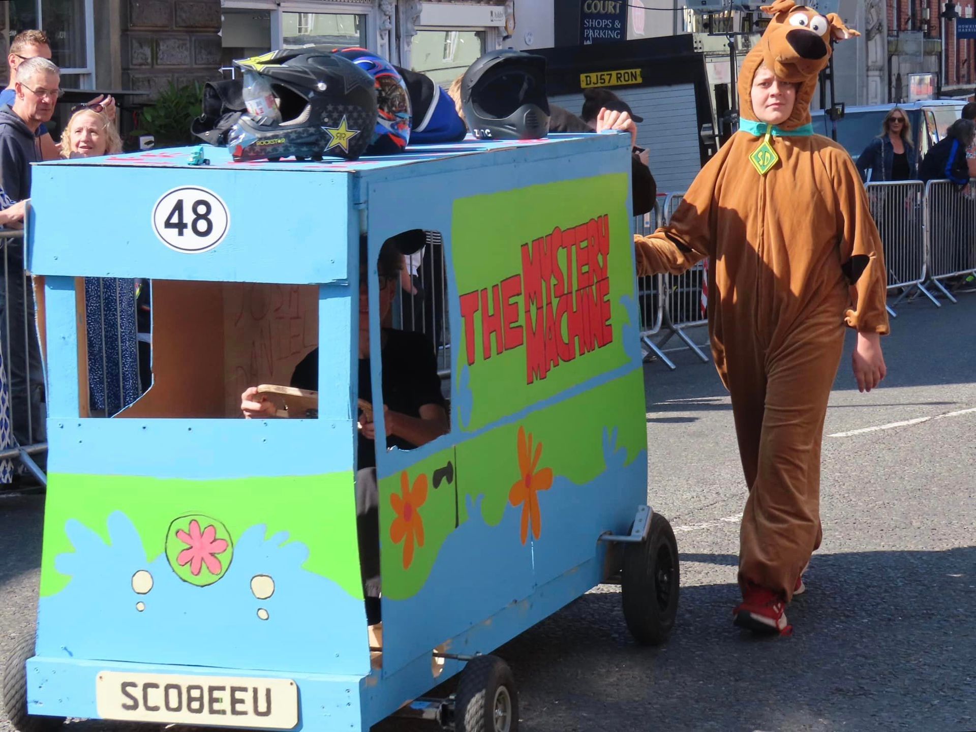 Scooby doo is driving a scooby doo vehicle